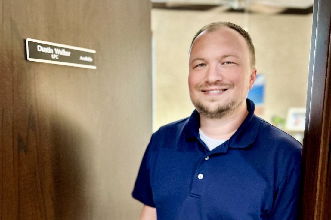 Dustin Walker, LPC standing at his office door in Edmond, OK